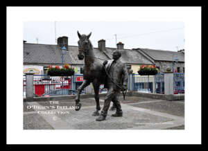 Ballinasloe     ~    "Horse Fair bronze sculpture"   ~     at St Michael’s Square.    ~    It depicts a horse and a handler, both in realistic detail and expression. The sculpture, created by James McCarthy, is a tribute to the Ballinasloe Horse Fair, one of the oldest, dates back to the 18th century and most prestigious horse fairs in Europe.   ~    Co. Galway .....0816