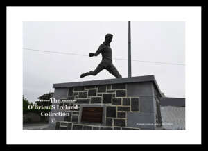 Moylough    ~     Main Street    ~    Moylough More,~ Enda Colleran (1942-2004) was a native of Moylough and a star of the Galway senior inter-county team that won three All-Ireland titles in a row in 1964, 1965 and 1966. He captained the team in the last two finals, becoming one of the few players to achieve this feat. He also won two National League titles, six Connacht titles and two Railway Cup titles with Connacht. He played club football with Mountbellew-Moylough and won two Galway senior championships.  ~    Co. Galway .....0899