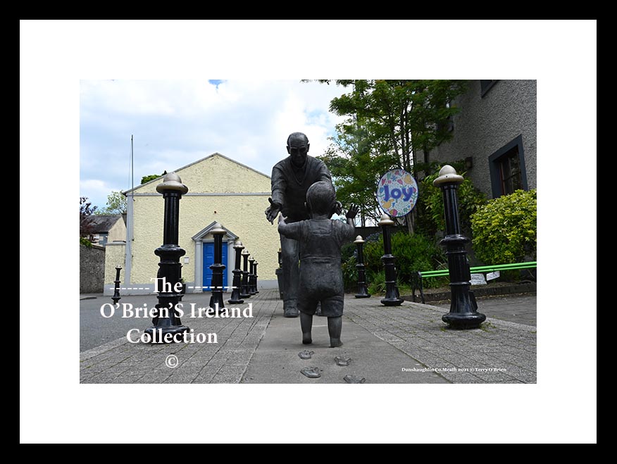 Dunshaughlin ~ Main Street ~ Spring to Autumn Bronze old man with toddler , footprints and poetry on limestone base,Commissioned by Meath Co. Council., 2009 sculptured By Ann Meldon Hugh ~ Co Meath...3442